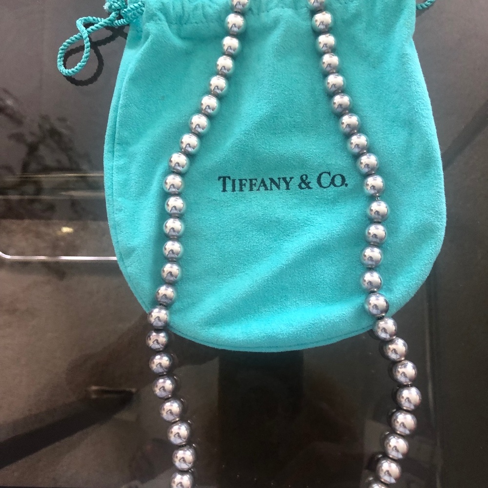 24” Tiffani silver necklace with original pouch.